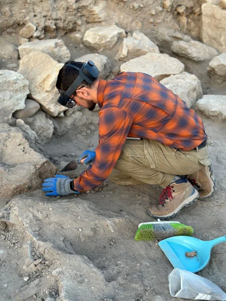 HKU archaeology PhD candidate Mr Hayk Azizbekyan digging on-site while wearing an MR headset and viewing the real world and the previously recorded 3D data. (Photo credit: HKU Faculty of Arts)  