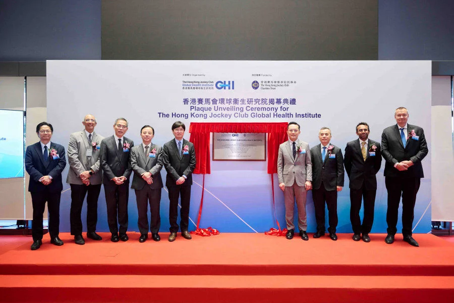 Officiating guests at the plaque-unveiling ceremony of the HKJCGHI: (from left) Professor Leo Poon Lit-man, Co-Director of the HKJCGHI; Professor David Bishai, Director of the School of Public Health of HKUMed; Professor Chak-sing Lau, Vice-President & Pro-Vice-Chancellor (Health) and Dean of Medicine of HKU; Professor Xiang Zhang, President and Vice-Chancellor of HKU; Dr Henry Chan, Steward of the Hong Kong Jockey Club; Dr Ronald Lam, Director of Health, the Government of the HKSAR; Mr Wong Yan-lung, Deputy Chairman of the Friends of Cambridge University in Hong Kong; and Professor Ravindra Gupta and Professor Florian Marks, Co-Directors of the HKJCGHI.  