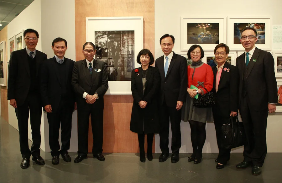 Guests walk around the “World of Doctors” section, which captures the challenges and moments in the lives of 29 Faculty professors, alumni and students, through the lens of renowned photographer Ducky Tse.