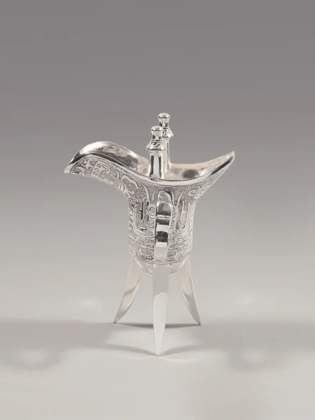 Jue–shaped cup  Cast, chased and polished sterling silver Hong Kong, Wai Kee Jewellers Ltd., 1980s Stamped with Wai Kee trademark and collector’s mark Loan from the Estate of Kwan Sai Tak