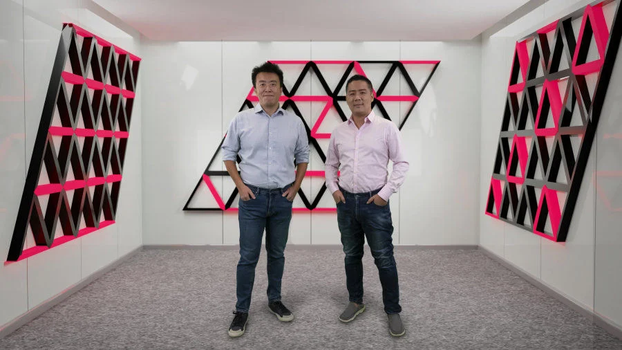 Figure 1. Research Assistant Professor Zheng YAN (on the right) and Associate Professor Zi Yang MENG from HKU Department of Physics standing in the imaginary space decorated with the novel quantum states they discovered. The HKU Physics team and their collaborators designed a soft-constrained model to describe the programmable quantum simulator and predict the novel entangled states on it. The research work has been published in Nature Communications recently.   