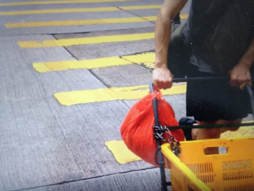 Man with Red Plastic Bag in Hong Kong