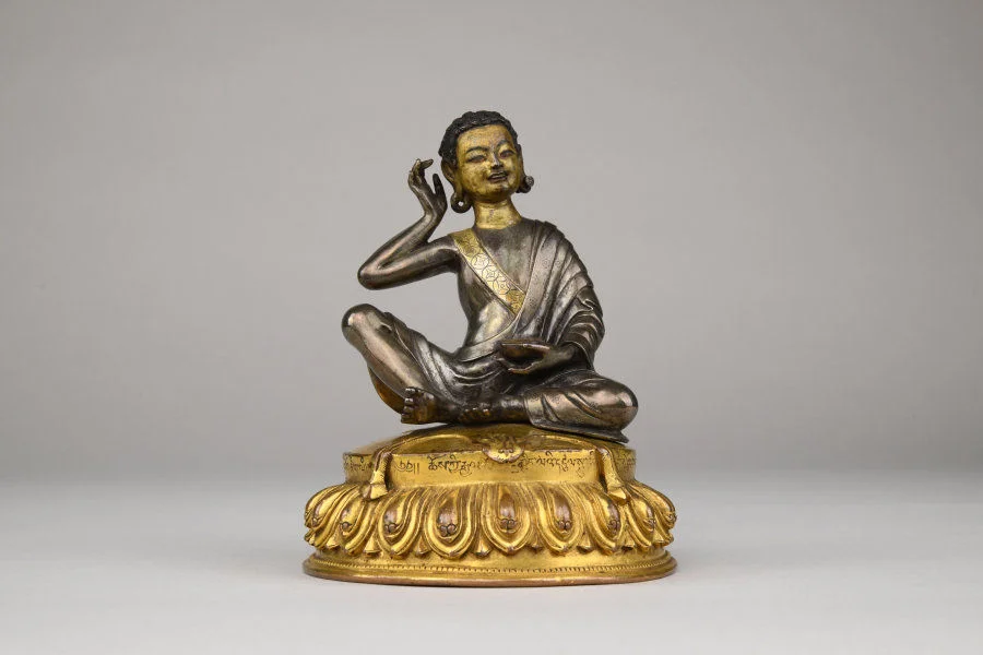 Figure of Milarepa Central Tibet 15th–18th century Parcel gilt silver with gilt bronze base H. 13 cm Nyingjei Lam Collection