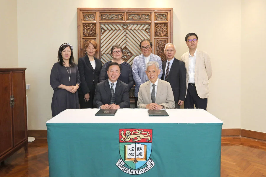Mr Tin Hing Sin, Chairman of the Tin Ka Ping Foundation (front right), signs the donation agreement with HKU President and Vice-Chancellor Professor Xiang Zhang (front left).  Back row from left to right: Ms Bernadette Tsui Wing-Suen, HKU’s Associate Vice-President (Development & Alumni Affairs); Ms Peggy Cheung, Director of the Tin Ka Ping Foundation; Professor Lin Goodwin, HKU’s Dean of Education; Mr Tai Hey-Lap, Vice Chairman of the Tin Ka Ping Foundation; Mr Tin Wing Sin, Director of the Tin Ka Ping Foundation; and Mr David Day, Chief Executive of the Tin Ka Ping Foundation.