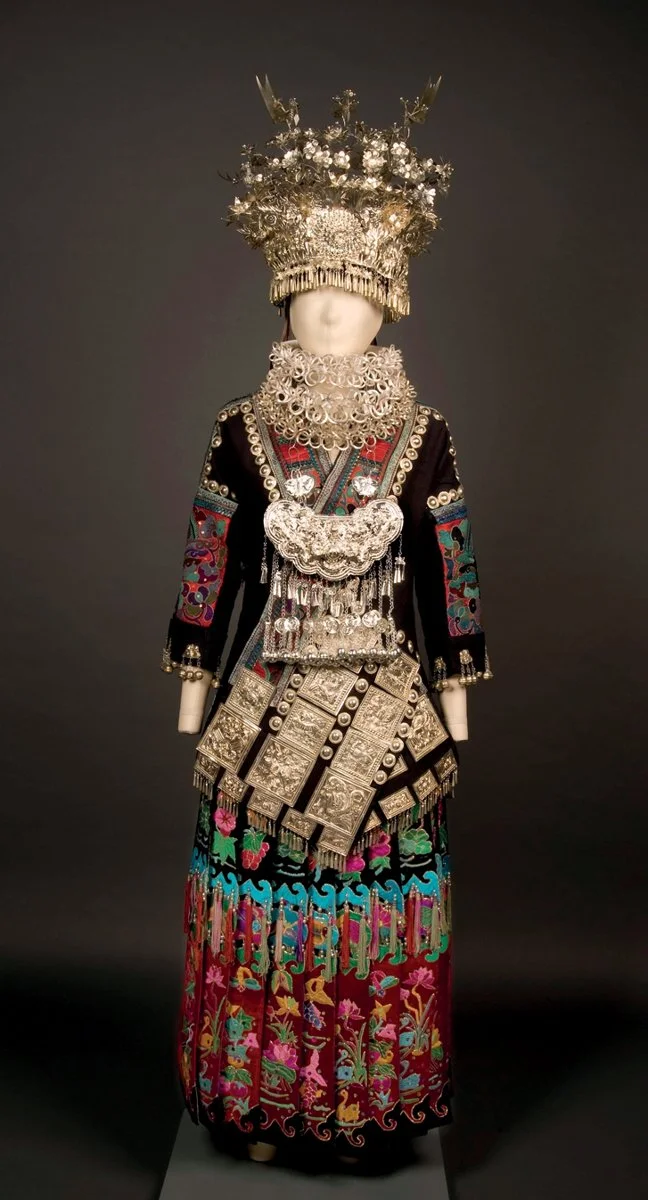 Woman’s festive attire Miao ethnic minority Taigong Town, Taijiang County, Guizhou Province Length of upper garment: 86cm Width between cuffs: 123cm Length of skirt: 78cm   Waist: 88cm Overskirt: 95cm    Waist: 95cm (Collection of Mei-Yi LEE)