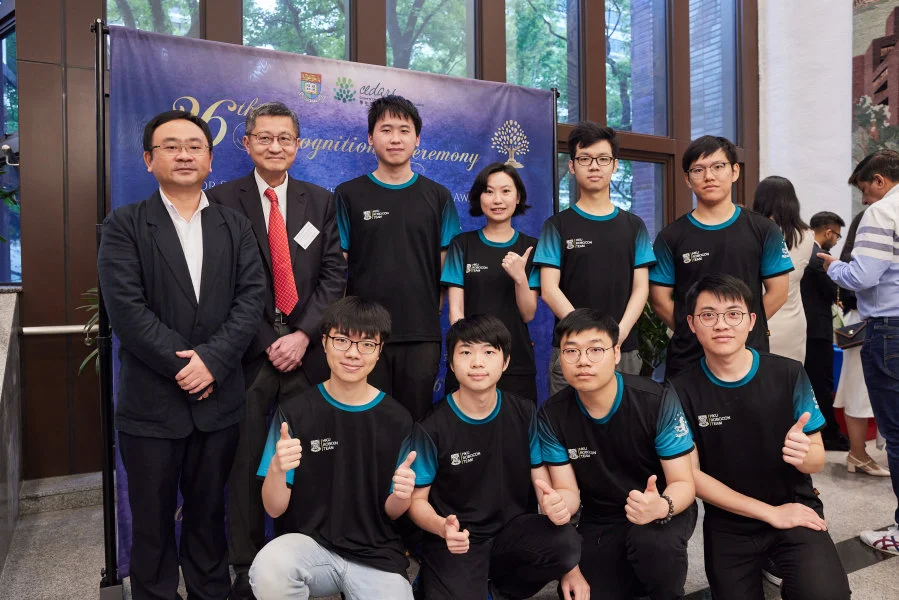 Student awardees celebrate their triumphs with their teachers, friends and family members together.  