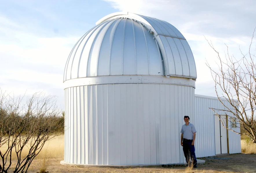 Thomas G. Kaye standing next to the Raemor Vista Observatory in southeastern Arizona USA. This telescope provides rapid response optical followup for newly discovered astronomical objects. It is currently being upgraded to a 1.1 metre telescope. Image Credit: Thomas G Kaye.  