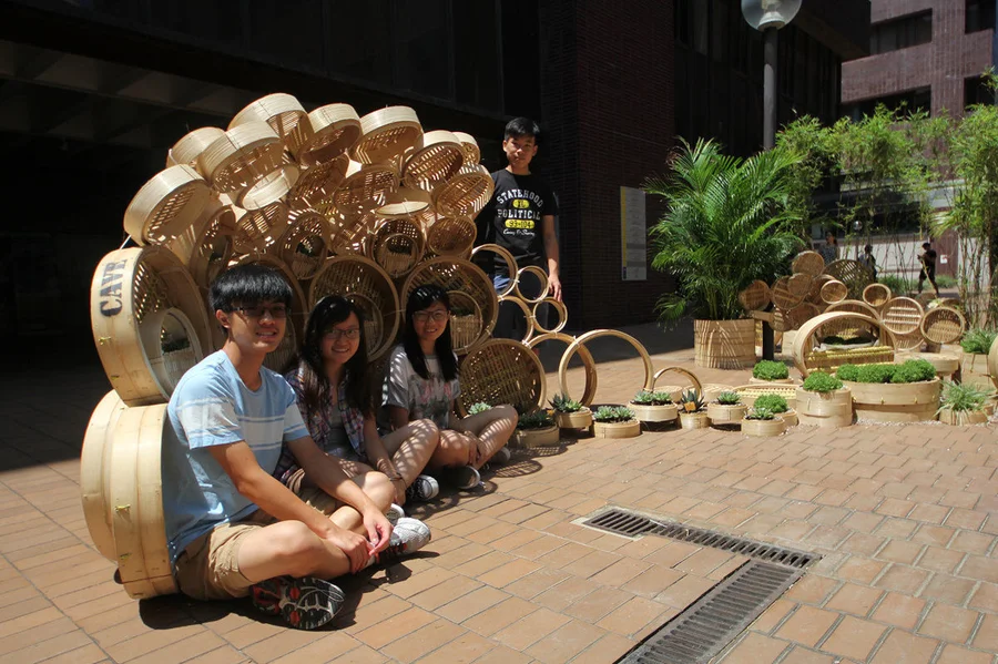 Chan Sze Wah, Lai Shu Yin, Li Issac, with their TA Yuen Chun Yin, taking photo at their installation 
