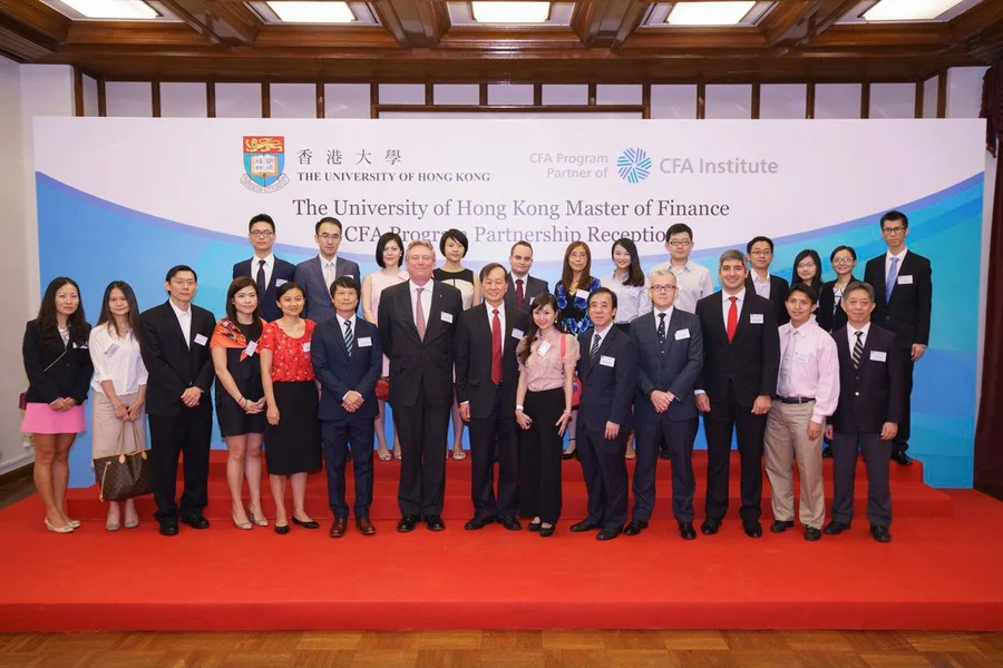 Paul Smith, CFA, President and CEO, CFA Institute (Front Row, 7th from Left), Neil Govier, CFA, Head of Education, Asia Pacific, CFA Institute (Front Row, 4th from Left), Professor Eric C. Chang, Dean of the Faculty of Business and Economics, HKU (Front Row, 8th from Left), Dr. Rujing Meng, Director of the HKU Master of Finance Programme (Front Row, 5th from Left), alumni of the HKU Master Finance Programme and the other faculty representatives, joined hands to launch the CFA Program Partnership.