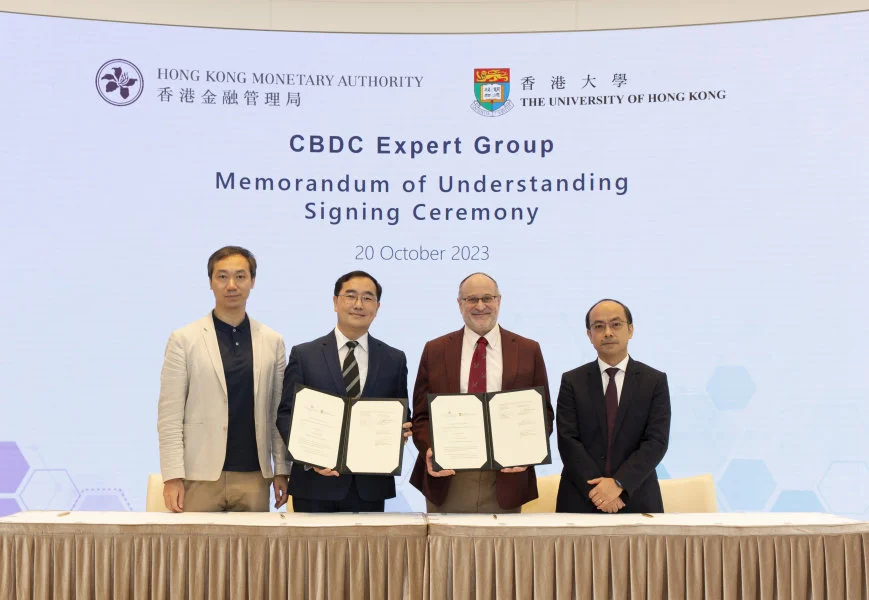 HKU and HKMA sign MOU. (From left) Professor Chen LIN; Mr Colin POU, Executive Director (Financial Infrastructure), HKMA; Professor David SROLOVITZ and Professor Simon YOUNG  