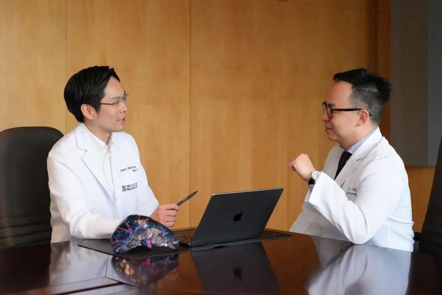 Professor Albert Chan Chi-yan (left) and Dr Chiang Chi-leung collaborate once more to develop the innovative ‘cocktail’ strategy—Locoregional therapy and immunotherapy (LRT-IO) approach. This method features three treatment stages: stereotactic beam radiotherapy (SBRT) with optional transarterial chemoembolisation (TACE), followed by immunotherapy (IO).  