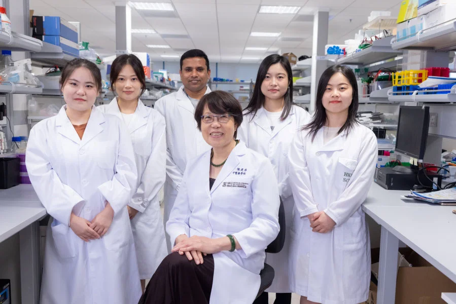 The research team led by Dr Chen Jianping (middle) discovers fatty liver disease can exacerbate breast cancer. The team members include Dr Sui Yue (back row, second left), Dr Ganesan Kumar (back row, middle), and Dr Liu Qingqing (back row, second right).  