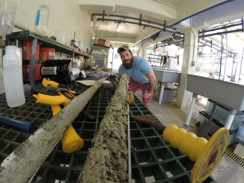 Cybulski looking down the “fossil time machine” containing coral fossils for analysis.  (Photo credit: Dr Kiho Kim)  