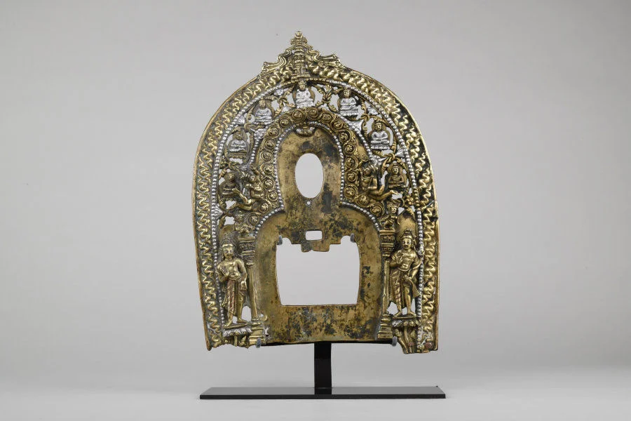 Halo for a seated buddha Kashmir 8th century Bronze with silver inlay H. 29 cm Private collection